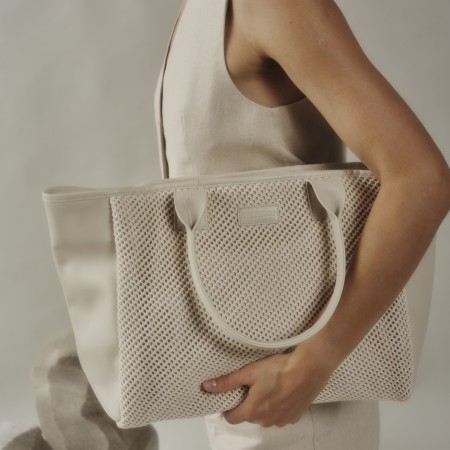 Kimi Coco is a bag made out of sophisticated leather, featuring a smooth and structured design adorned with a crochet pather leather on the sides. Its elegant curved handles provide a comfortable and secure grip, while the contrast crochet leather adds a refined and unmatchable touch. With a spacious interior and sturdy construction, this bag is both stylish and practical, perfect for elevating everyday outfits or complementing a chic, formal look as you can wear it with any piece of clothing. The shipping is free in our online store.