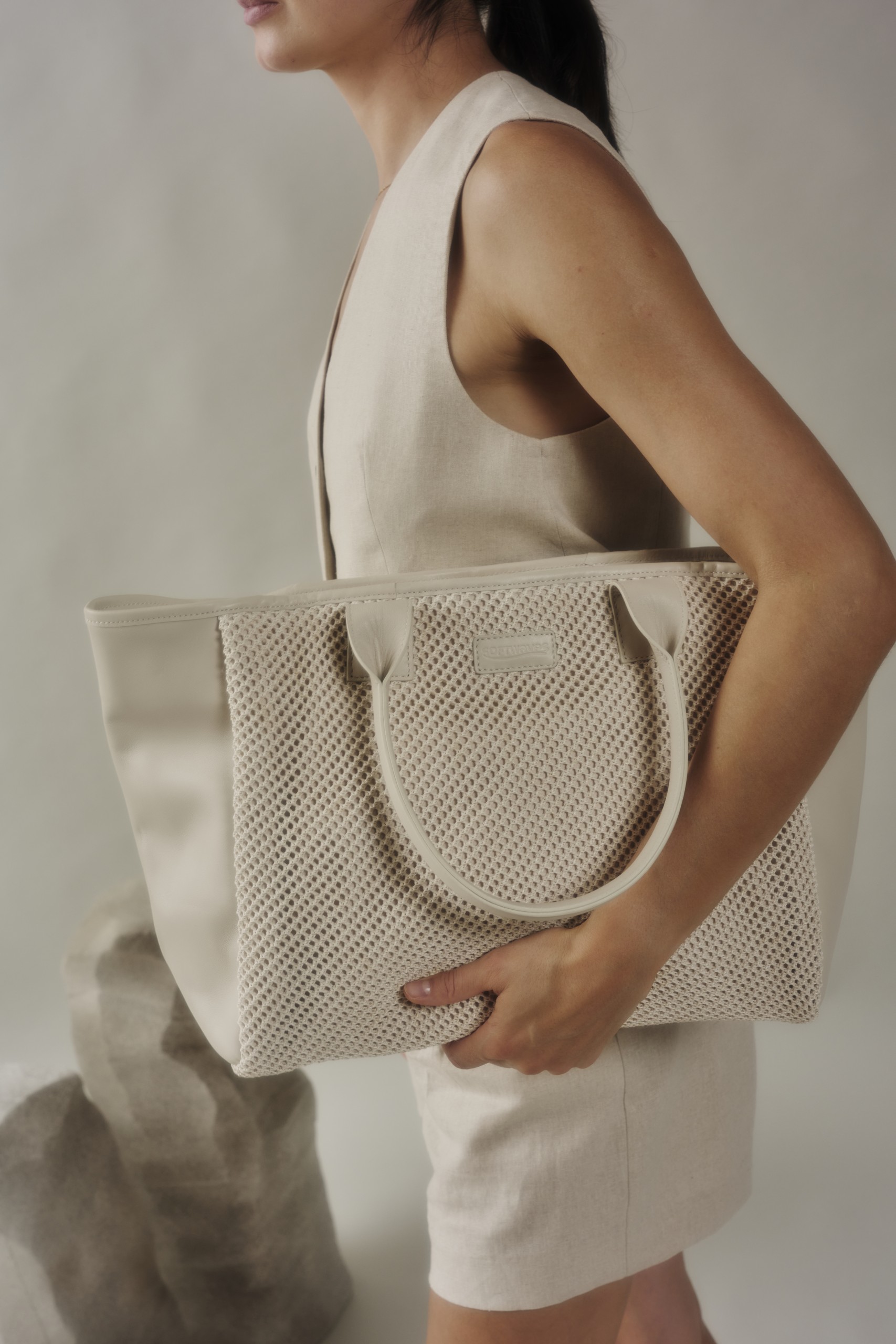 Kimi Coco is a bag made out of sophisticated leather, featuring a smooth and structured design adorned with a crochet pather leather on the sides. Its elegant curved handles provide a comfortable and secure grip, while the contrast crochet leather adds a refined and unmatchable touch. With a spacious interior and sturdy construction, this bag is both stylish and practical, perfect for elevating everyday outfits or complementing a chic, formal look as you can wear it with any piece of clothing. The shipping is free in our online store.